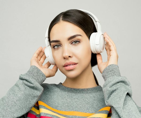 Close up of a person looking relaxed and happy outdoors.